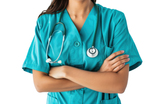 Medical professional in scrubs stands confidently with arms crossed in a healthcare environment