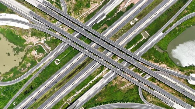 Aerial view drone footage of a complex bridge intersection where multiple highway numbers 290 and 304 Nakhon Ratchasima Thailand