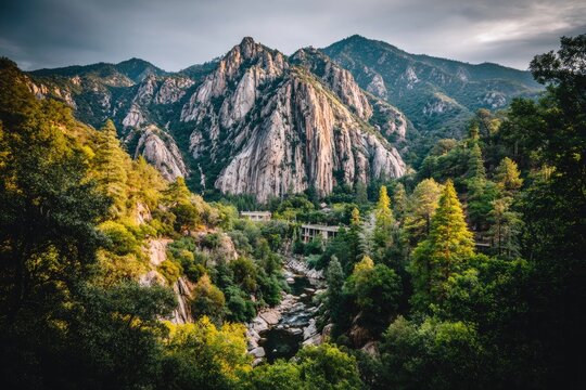 Mountain valley scene with rocky peak and lush foliage