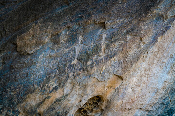 Stick figures carved into the rock at Gobustan rock park