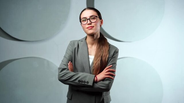 Young Caucasian woman transitions through five roles student, businesswoman, artist, fitness enthusiast, homemaker smiling to camera. Neutral studio lighting highlights womens diversity