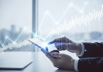 Man using tablet with digital stock chart overlay