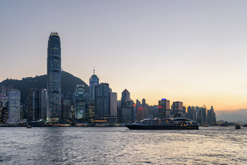 Fototapeta premium Awesome view of cruise ship crossing Victoria harbor at sunset