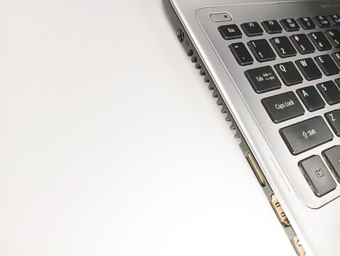Sleek Grey Laptop Keyboard Partially Visible on Clean Surface