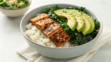 A grilled chicken bowl with avocado and kale for a healthy meal