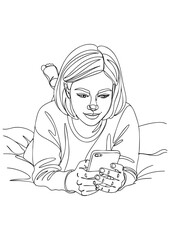 A young woman lies on her stomach on a bed, looking at her smartphone.