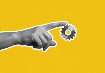 Innovative hand connecting a metal gear, symbolizing precision engineering, teamwork, and mechanical solutions against a vibrant yellow backdrop.