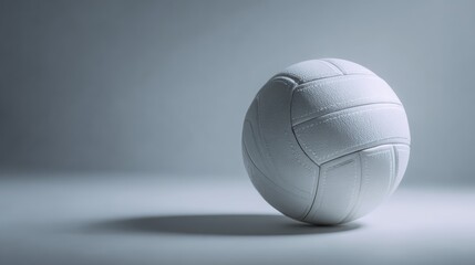 Volleyball on smooth grey blurred background