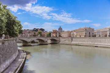 Scenic view of Rome from the Tiber River with historic buildings and old bridge