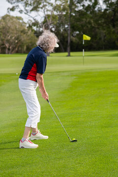 senior woman playing golf