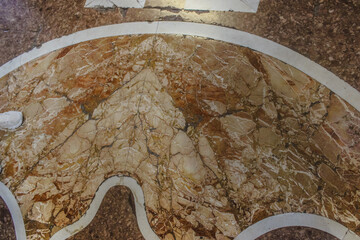 Ornate Stone Mosaic Flooring in a Historic Building.
Intricate Marble Floor Design of a Cathedral