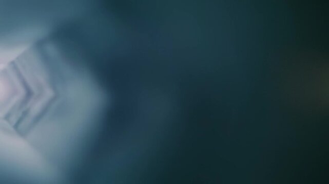 A pentagonal tunnel formed by bright light and waves of smoke extends into the distance, moving into the future. Slow mo, slow motion, high speed camera, 200fps