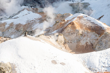 Snowy mountains and fields at Noboribetsu Jigokudani valley