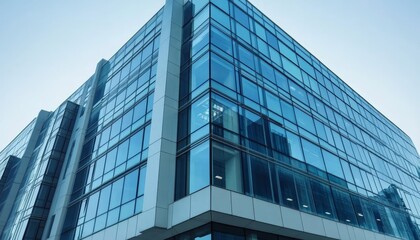 Obraz premium Striking Geometric Architectural Design of Modern Skyscraper with Reflective Glazing Walls