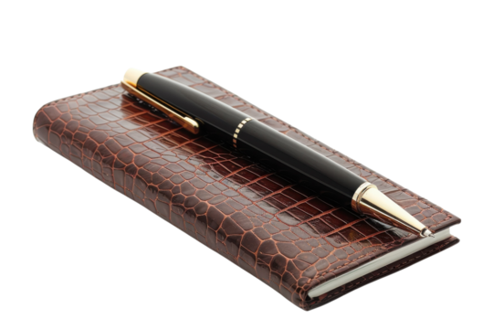 Elegant brown leather notebook with a sleek pen on a surface showcasing sophistication and functionality