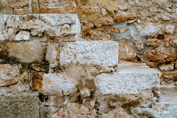 Close-up of old stone wall texture with stairs