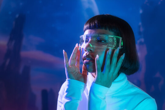 Latin woman engaging with futuristic virtual reality
