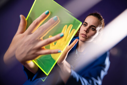 Young woman exploring augmented reality technology