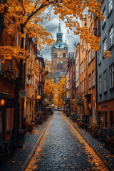 Fototapeta premium Clock tower towering over cobblestone street.