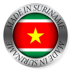 Made in Suriname button icon. Circular emblem with metallic border, glossy central flag, and bilingual label indicating product origin and international manufacturing identity.