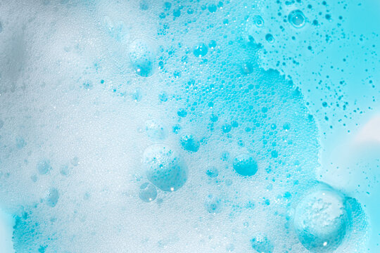 Blue foam texture close-up with bubbles and details