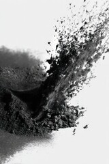 Detailed Shot of a Heap of Black Powder with Particles in Motion