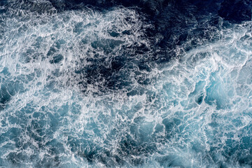 Ocean water surface background, aerial view of foamy water.  Artistic nature background image.