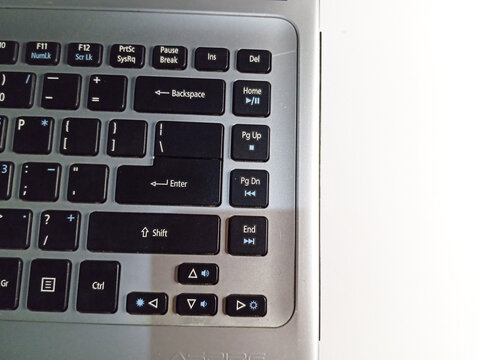 Modern Grey Laptop Keyboard Close-Up with Minimal White Backdrop