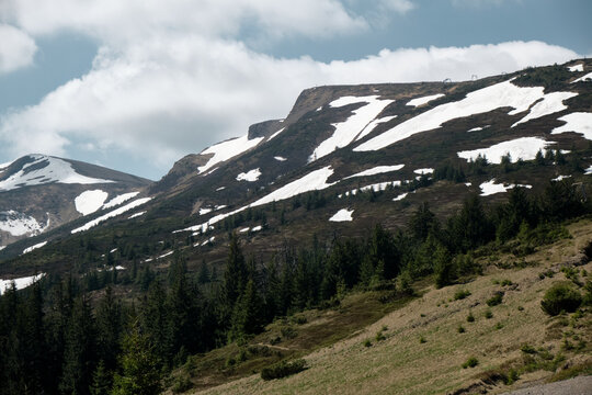 Snow-capped Svydovets Mountain Range under Cloudy Sky