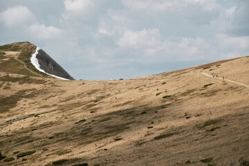 Hiker Ascending Svydovets Mountain in Carpathian Range