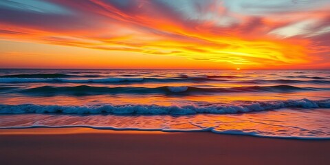 Vibrant sunset over calm ocean waves, sandy beach, tropical, sunset
