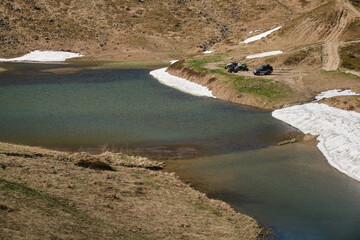 Serene Mountain Lake with Snow-Capped Peaks in Western Ukraine