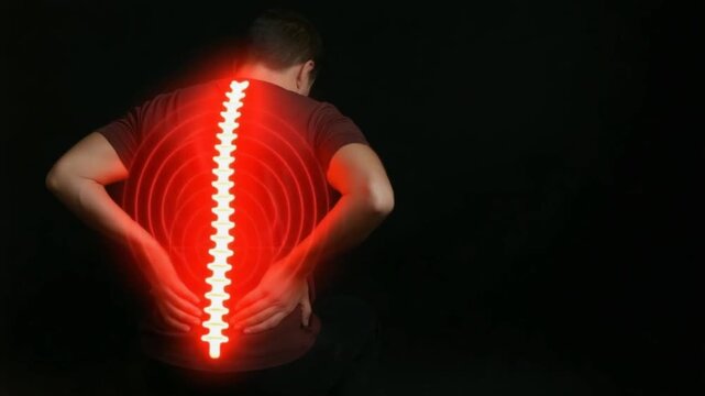 A man sitting on a dark background with glowing red concentric circles on lower back, Lower Back Pain, spine pain, medical issues