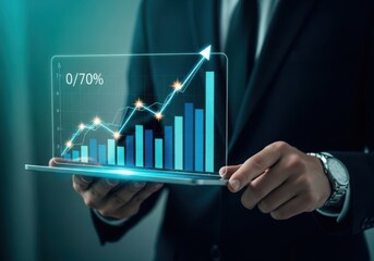 Businessman analyzing financial growth with a holographic stock market chart