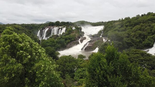 Mysuru, Karnataka, India-June 12 2025; A Mesmerizing Waterfall, cascade, rapid, gagana chukki, bluff, rock, rainforest, cloud of mist, fog, water, jog fall, flowing in the western Ghats of India.
