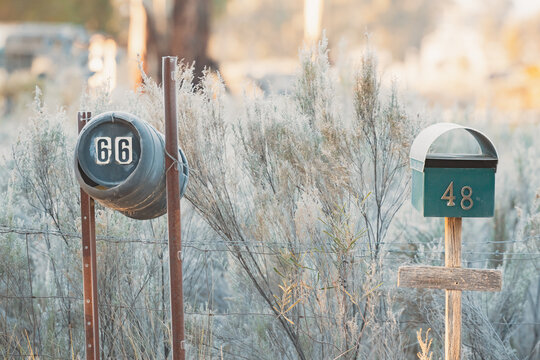 Mail boxes along rural country road on frosty winter morning