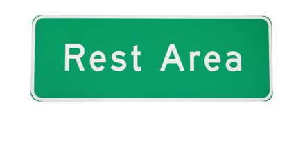 Green Rest Area Sign on Cracked Asphalt Road Surface