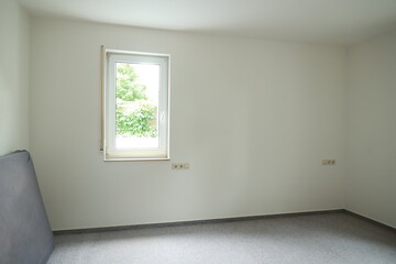 Bedroom with a window and a bed