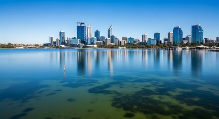 Fototapeta premium Panoramic view of Perth city skyline reflected in the tranquil Swan River