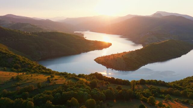 Kardzhali Reservoir aerial view golden sunset, winding lake between forested hills mountains in southern Bulgaria, peaceful summer scenery from lookout point, perfect for nature, travel landscape