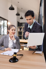 Lawyer with Document Paper and Hammer on Wood table,  Judge's Gavel, Law, Justice Symbol, Agreement and Partnership Concept,