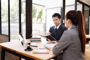 Lawyer with Document Paper and Hammer on Wood table,  Judge's Gavel, Law, Justice Symbol, Agreement and Partnership Concept,