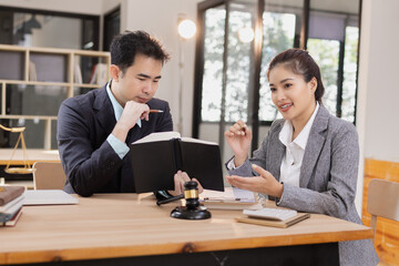 Lawyer with Document Paper and Hammer on Wood table,  Judge's Gavel, Law, Justice Symbol, Agreement and Partnership Concept,