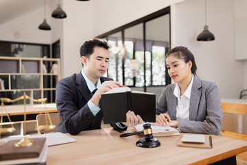 Lawyer with Document Paper and Hammer on Wood table,  Judge's Gavel, Law, Justice Symbol, Agreement and Partnership Concept,