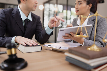 Lawyer Team Working with Documents and Signing Contract at Office Desk.
