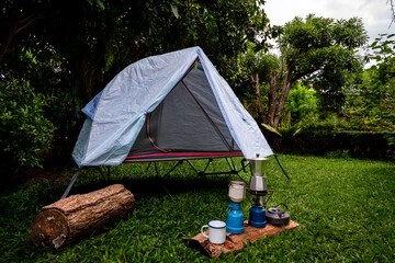 Camping tent in the forest, falling leaves in winter  in a forest camping area