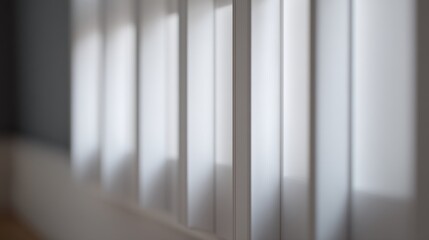 Obraz premium A blurred close-up of vertical blinds with soft light filtering through,
