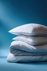 Stack of white bedding sheets on blue background