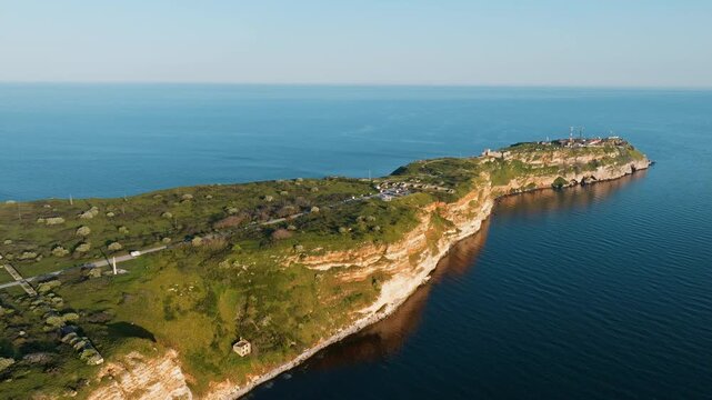 Cape Kaliakra aerial view shot summer light Bulgarian nature coastline cliffs against blue water history-rich landform top visited destination for European travelers perfect coastal seascape from air