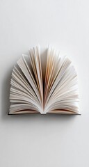 Open book, pages fanned in a semi-circle, showcasing creamy off-white paper against a bright white background; clean, minimalist aesthetic